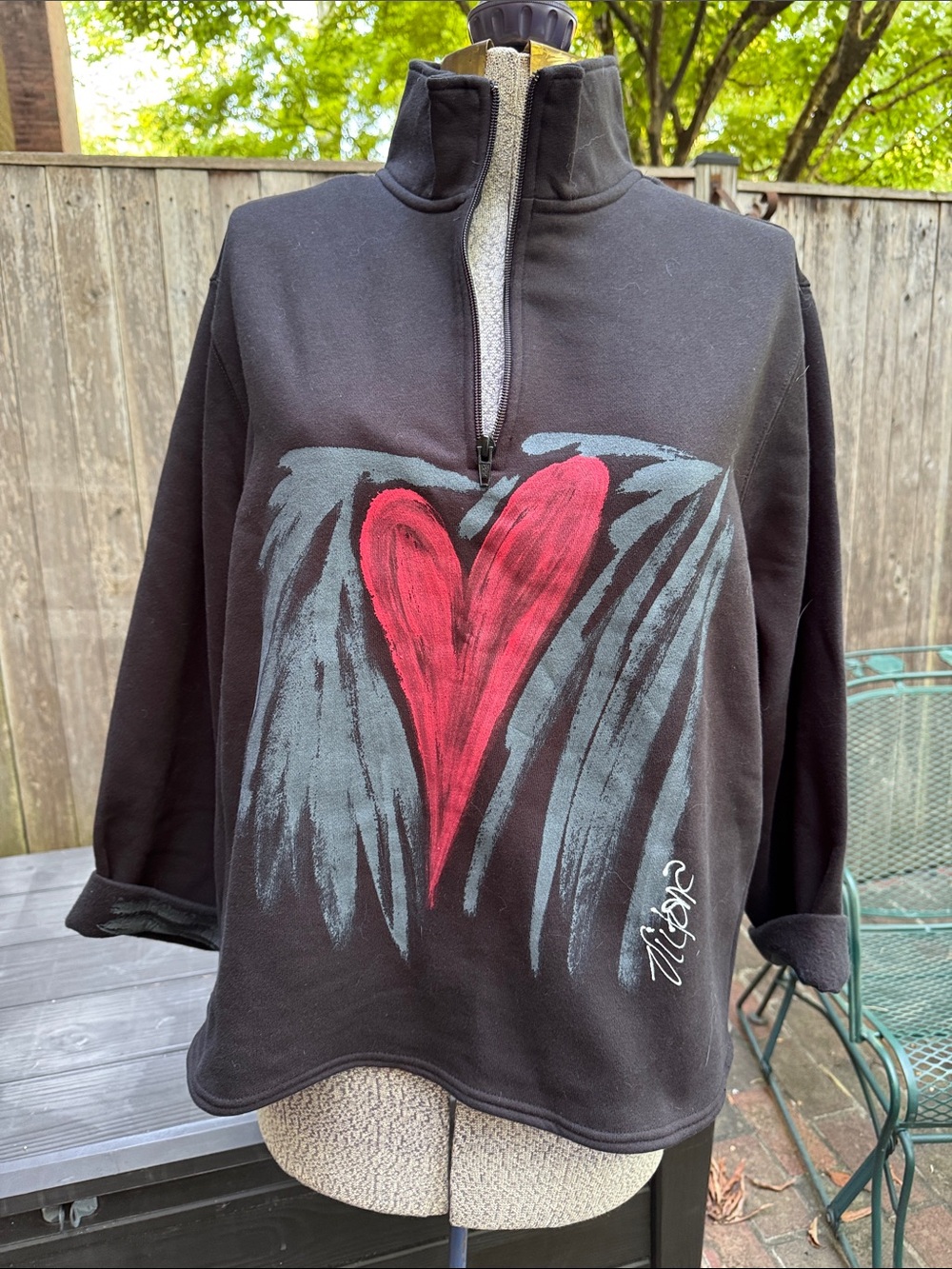 Black Quarter-Zip Sweatshirt with Red Heart Graphic